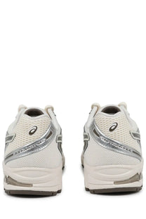 White asics gel-kayano 18 running shoes with silver accents and mesh upper in a unisex beige gel ds trainer design