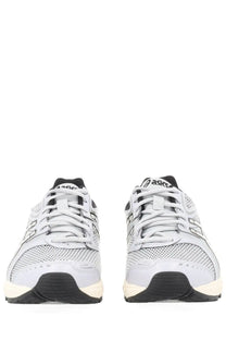 Asics unisex gel ds trainer grey sneaker with light gray and black mesh uppers and white midsoles in retro design
