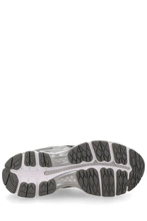 Back view of asics unisex sneaker gel kayano beige showing gray and white rubber sole with textured tread and asics logo
