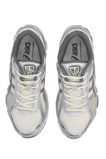 Asics unisex sneaker gel kayano 10 in silver and white with mesh uppers and metallic accents for running