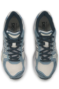 Light blue and white ASICS unisex Gel Kayano 14 running shoes with dark navy laces for performance running