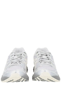 A pair of asics unisex sneaker gel kayano grey running shoes with silver gray mesh uppers white laces and rubber sole