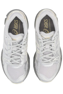 Asics unisex sneaker gel kayano grey with white and gray mesh uppers and a sleek modern running shoe design