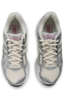 Asics unisex sneaker gel kayano in silver and white with mesh uppers metallic silver accents and pink branding on the tongue