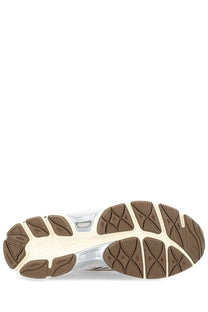 The back side of an asics unisex sneaker gel nyc features a beige midsole with brown rubber outsoles and silver accents