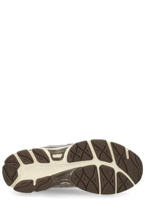 Brown and cream rubber sole with textured geometric tread on asics unisex sneaker gel nyc multicolor