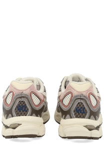 Pair of asics gel-nimbus 2019 sneakers in pink gray and cream mesh and synthetic with visible gel branding on heel back side