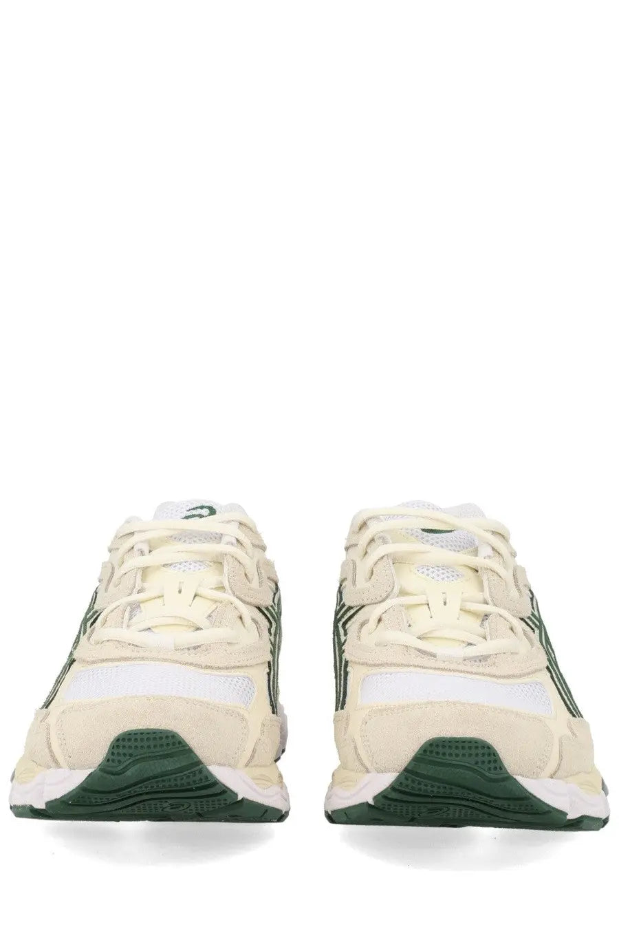 Cream-colored asics unisex sneaker gel nyc white with dark green accents and a textured rubber sole