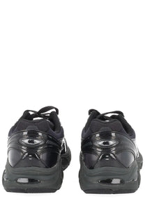 Back view of asics unisex sneaker gt black glossy black sneakers with chunky sole and reflective eye logo on heel