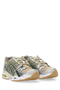 Asics women’s gel nimbus sneaker in silver and beige with black geometric detailing for running and training