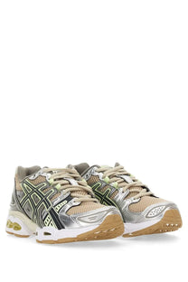 Asics women’s gel nimbus sneaker in silver and beige with black geometric detailing and tan rubber sole