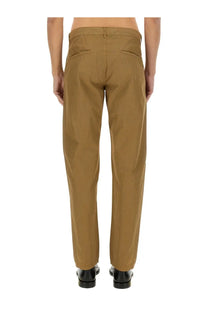 Back side of aspesi men’s beige chino pants in tan with straight-leg cut and two rear pockets