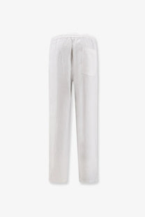 White linen trousers with a relaxed fit and a single back pocket shown from the back by aspesi men’s ventura