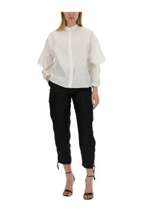 White blouse with voluminous fluttery sleeves and high collar paired with aspesi women’s black cargo pants