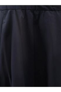 Black pleated skirt with smooth structured fabric shown from the back in aspesi women’s cotton skirt blue product image