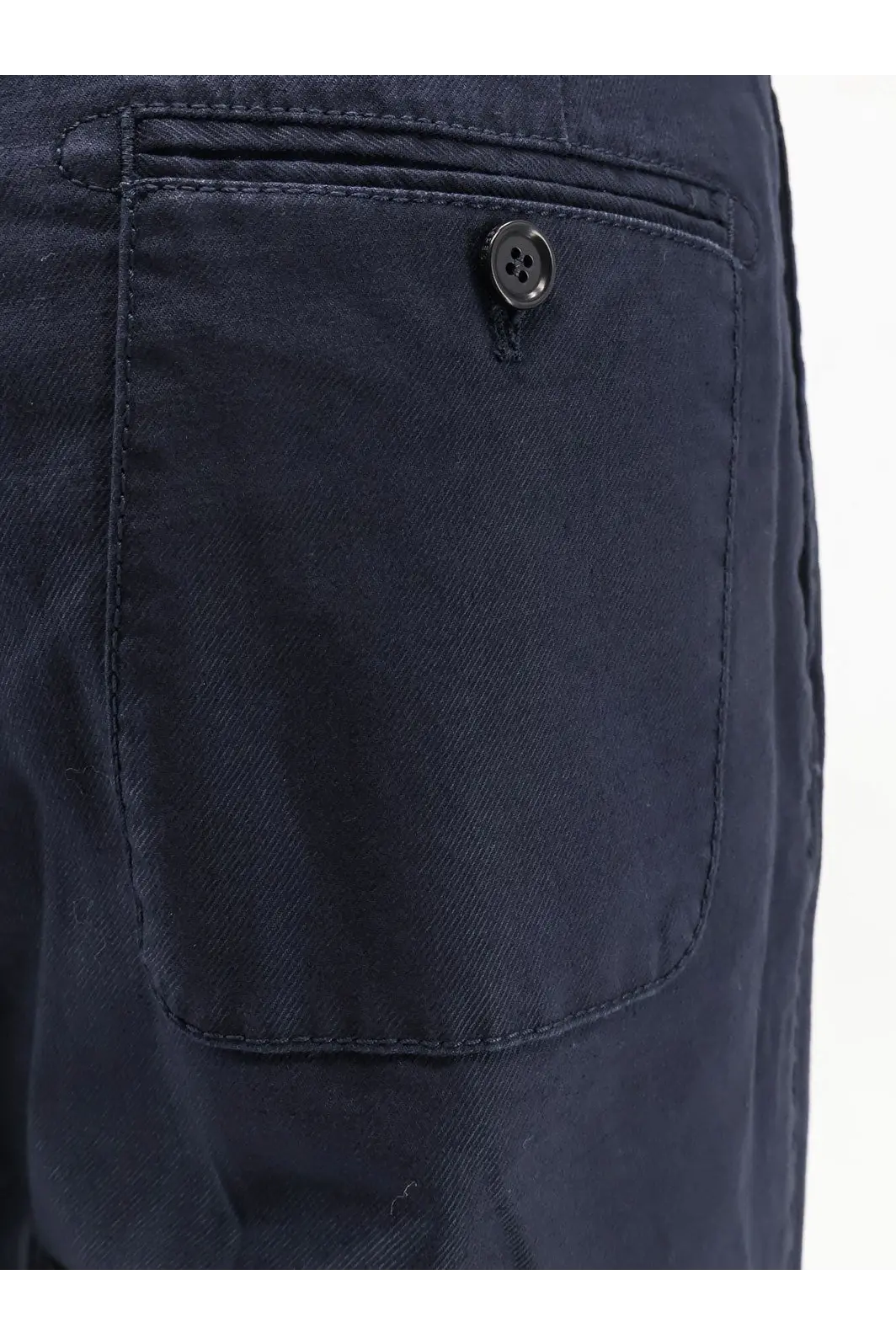 Back view of aspesi women’s dark navy cotton denim shorts with single button closure on back pocket