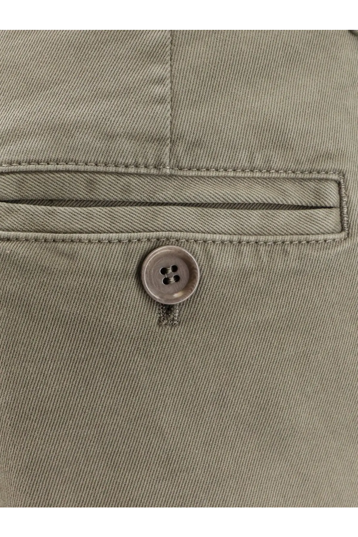 A round metallic button with four holes centered on a khaki fabric pocket of aspesi women’s grey cotton trousers