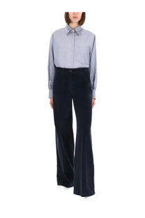 A pair of dark navy velvet flared trousers with high waist and button closure from aspesi women’s collection