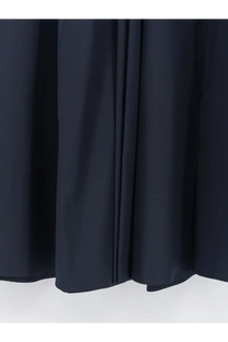 Dark navy pleated curtain fabric shown as a backdrop for aspesi womens long blue cotton skirt product display