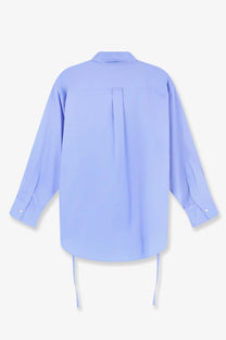 Back view of aspesi women’s light blue oversized cotton button-down shirt with central seam and hem drawstrings