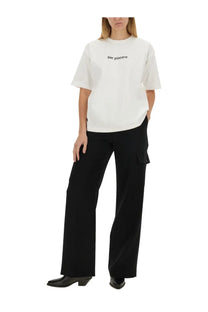 White short-sleeved t-shirt with per piacere print paired with aspesi women’s black pants in a casual outfit