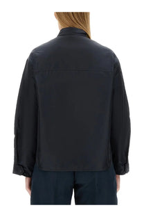 Black sleek long-sleeved aspesi women’s shirt with structured back and subtle seam detailing shown from the back side