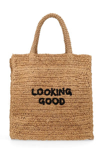 Beige woven straw tote bag by Aspesi with black embroidered looking good text perfect for shopping and casual use