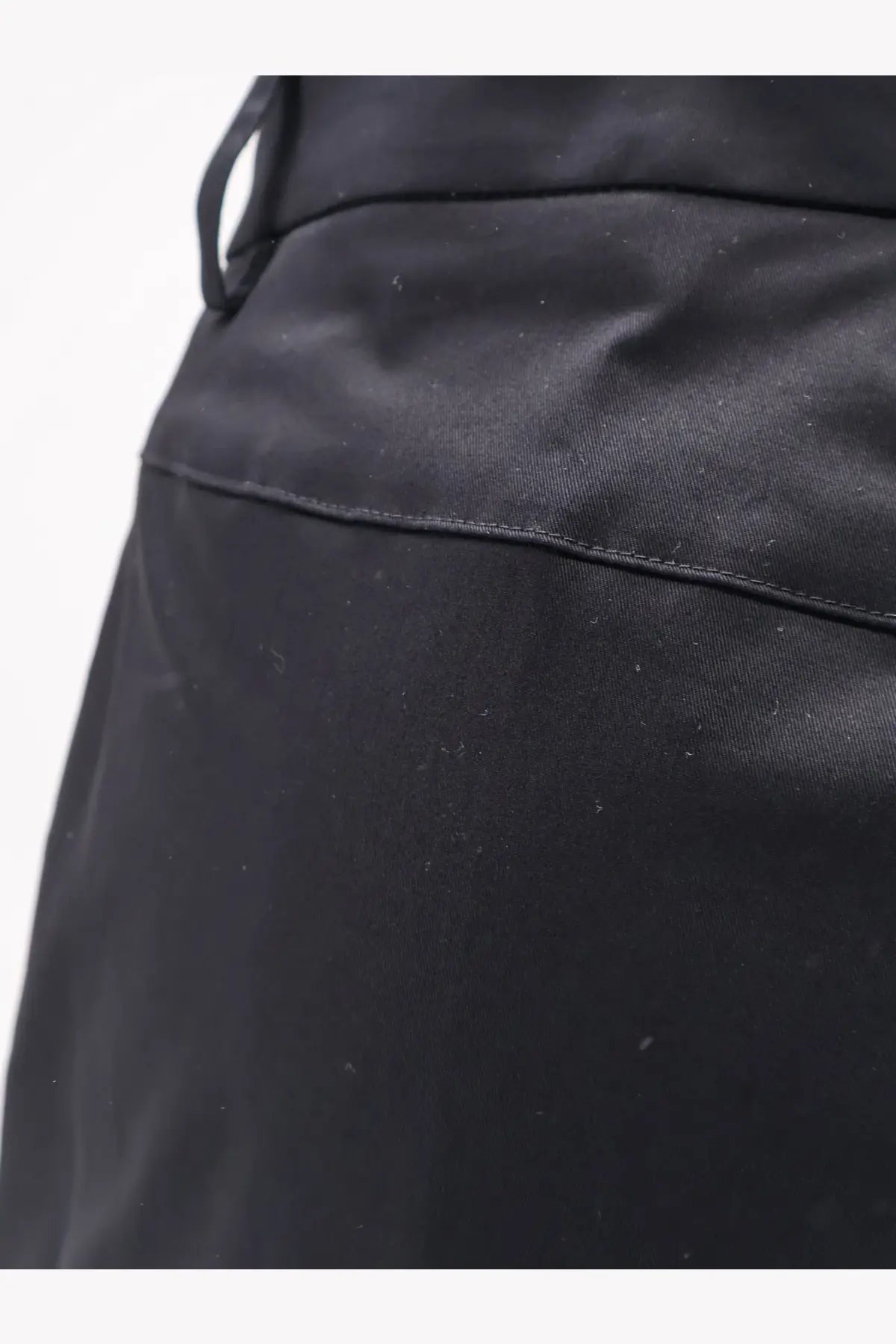 Black nylon drawstring bag with smooth glossy finish and visible stitching paired with aspesi womens stretch cotton trousers black