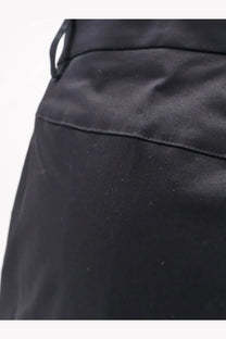 Black nylon drawstring bag with smooth glossy finish and visible stitching paired with aspesi womens stretch cotton trousers black
