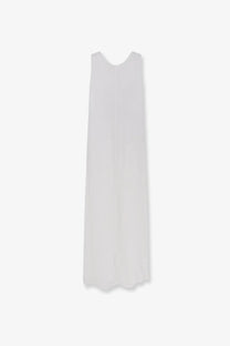 A flowing white sleeveless linen maxi dress with subtle v-neckline and scalloped hem by Aspesi women’s vissuto