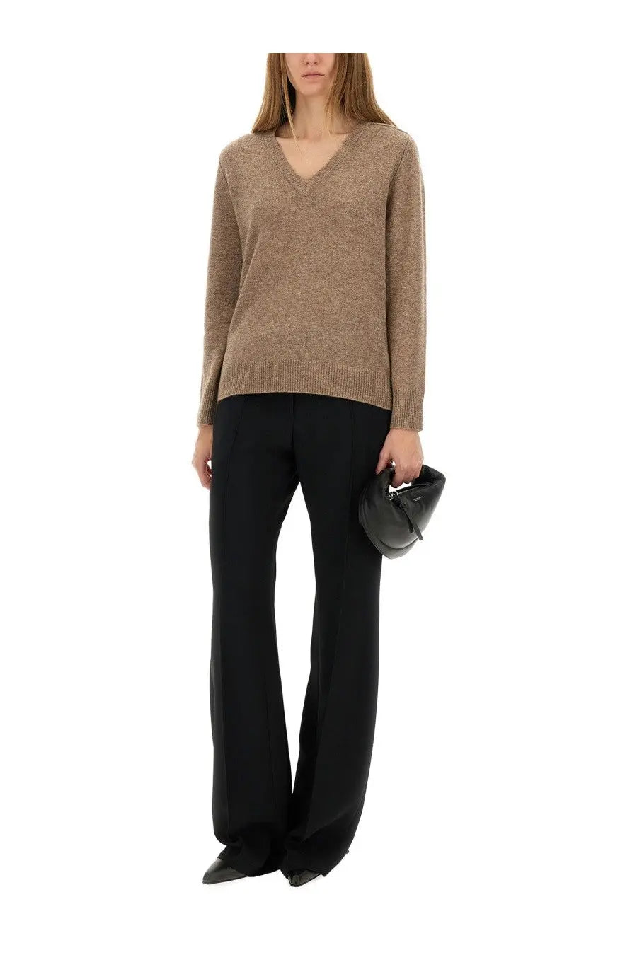 A sleek black leather clutch with minimalist design and subtle stitching paired with aspesi women’s beige wool blend sweater