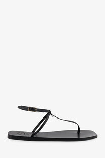Black leather thong sandal with minimalist design and silver-toned buckle by ATP Atelier women’s Alassio