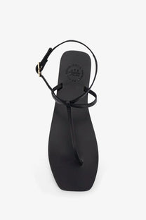 Black leather thong sandals for women with a minimalist design and adjustable ankle strap by ATP Atelier