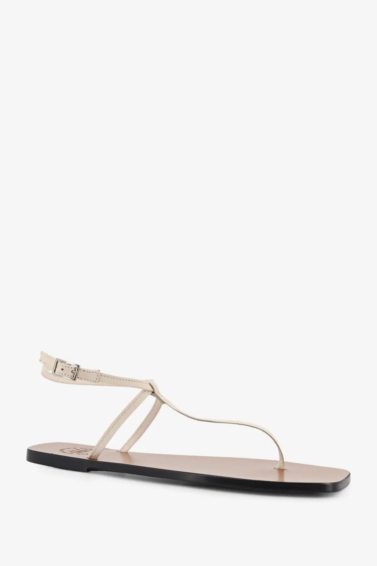 Cream-colored leather thong sandal with minimalist design and black rubber sole from ATP Atelier women’s Alassio linen collection