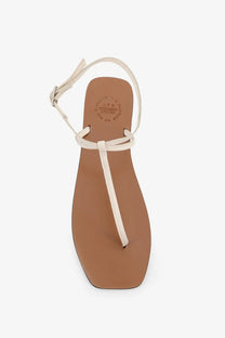 Cream-colored leather thong sandal with minimalist design and adjustable ankle strap from ATP Atelier women’s Alassio sandals linen