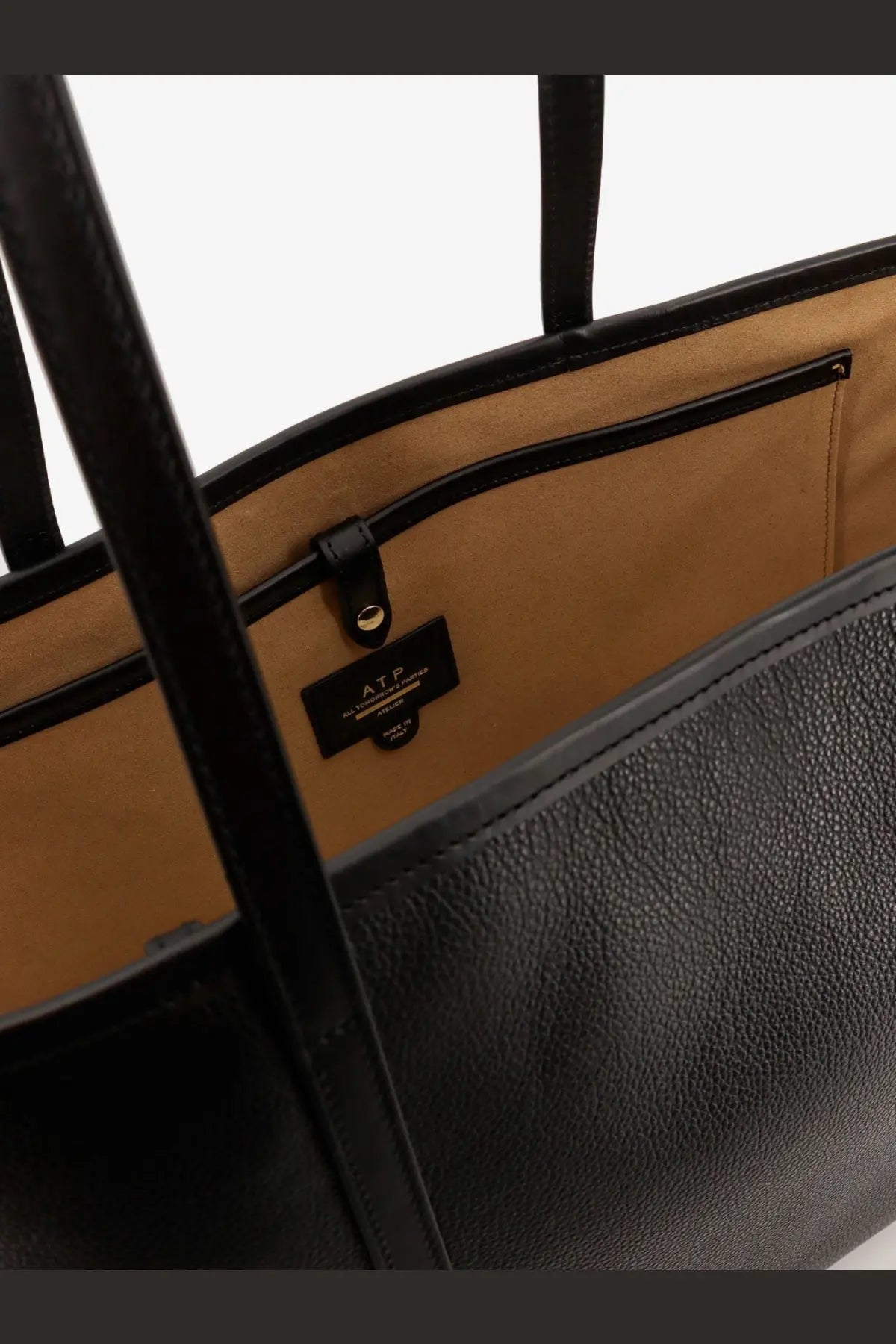 Atp atelier women’s eraclea black leather tote bag with black handles and tan pebbled leather interior