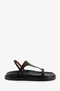 Black leather flat sandal with minimalist design and tan inner lining from ATP Atelier women’s Ultimo collection