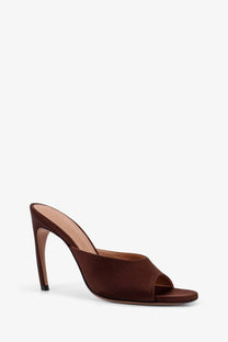 The attico women’s betta satin sandals brown are brown satin mule heels with a minimalist design and black-tipped stiletto