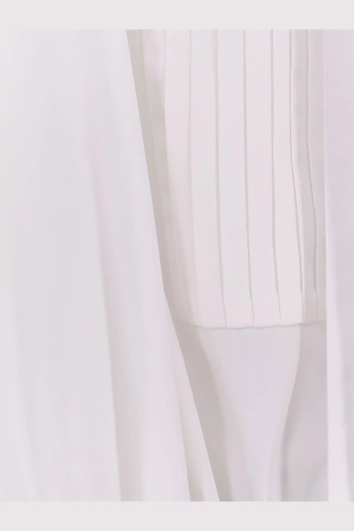 The attico women’s black white mini dress features white pleated fabric with vertical ridges and soft draping