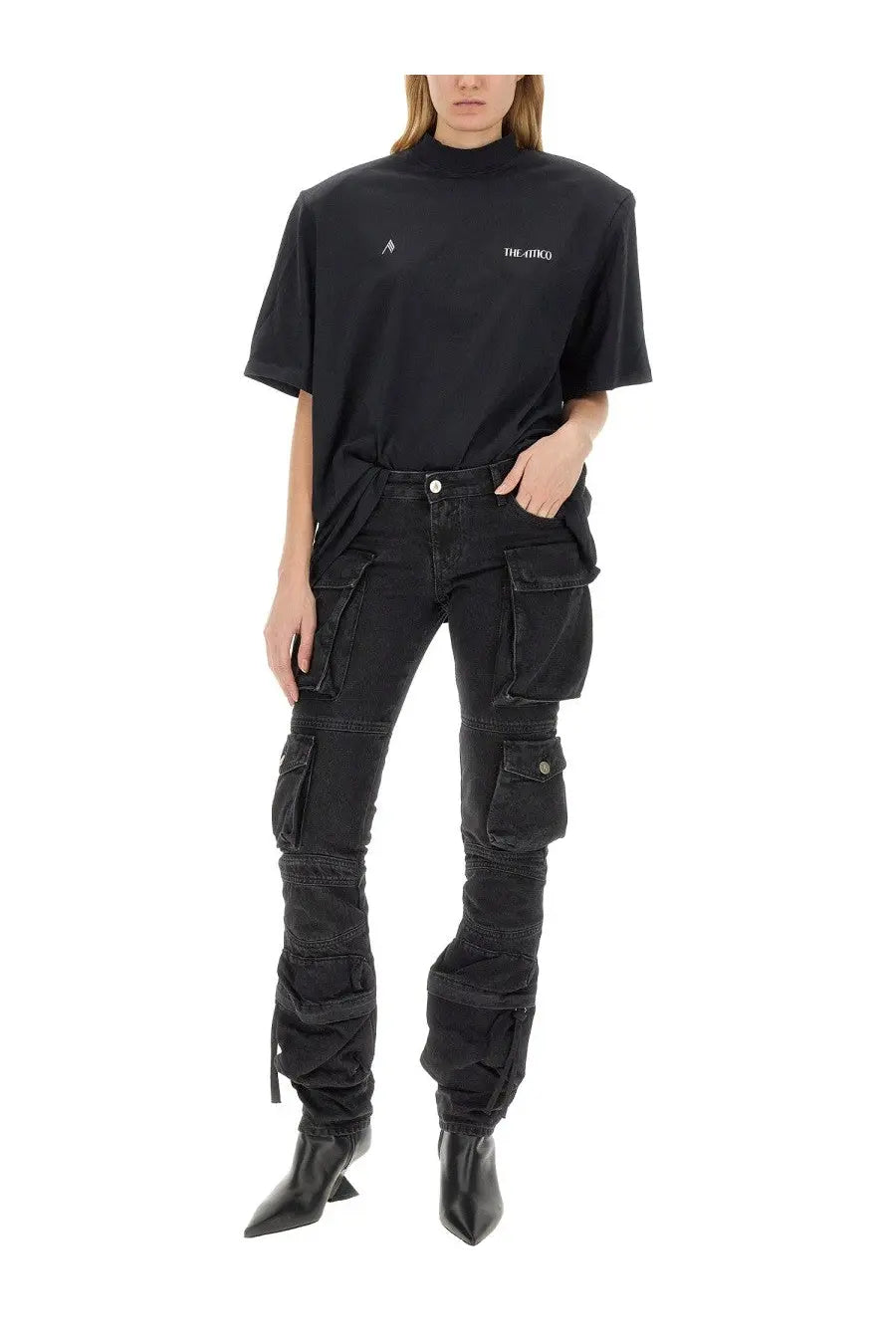 The Attico women’s cargo jeans black feature rugged layered black cargo pants with multiple pockets for utility and style