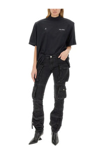 The Attico women’s cargo jeans black feature rugged layered black cargo pants with multiple pockets for utility and style