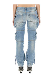 The Attico women’s cargo jeans blue are light-wash denim pants with multiple pockets and frayed hems