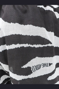 The attico women’s cotton beach shorts black paired with a black and white zebra-striped scarf with a textured weave