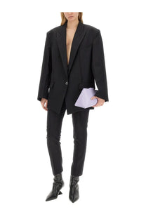Black oversized blazer with structured shoulders and single button closure from The Attico women’s cut out pants collection