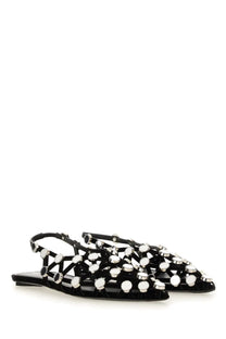 The Attico women’s dancer grid black flats feature black patent leather with silver-toned circular studs