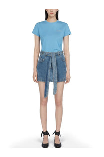 Light blue short-sleeved t-shirt with subtle embroidered logo paired with the attico women’s denim skirt blue