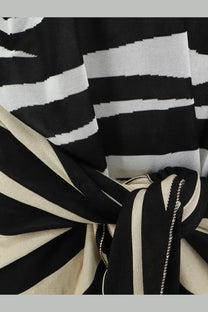 The Attico women’s Il Primo Bagno black white mini dress featuring black and cream striped knit fabric with knotted detail