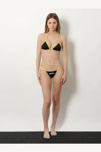The Attico women’s Il Primo Bagno lycra bikini set black features a black and yellow Ibizan triangle top and thong bottom