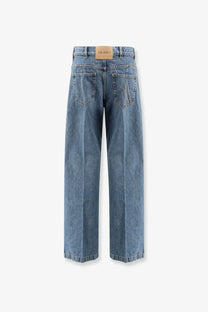 The back side of the attico women’s blue denim jeans with high waist wide legs classic pockets and leather brand tab