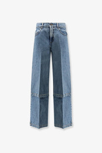 The Attico women’s jeans in blue feature light-wash denim wide-leg style with a high-rise waist and layered boxy cuffs
